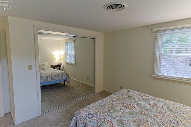 bedroom featuring a closet and carpet flooring