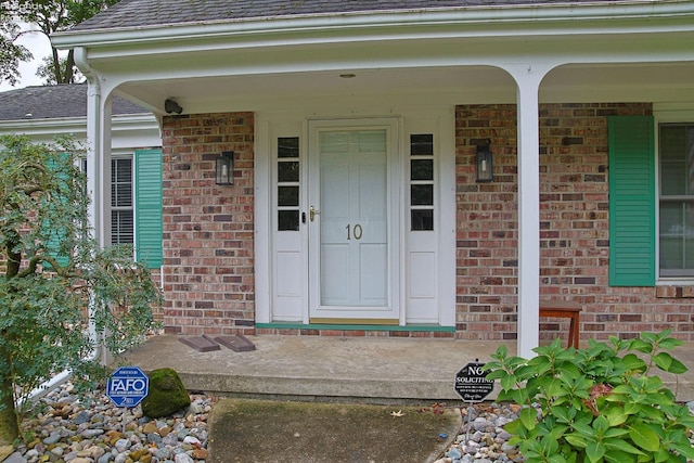 property entrance with covered porch