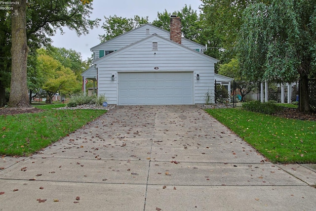 view of property exterior with a lawn and a garage