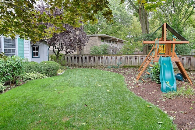 view of jungle gym featuring a lawn