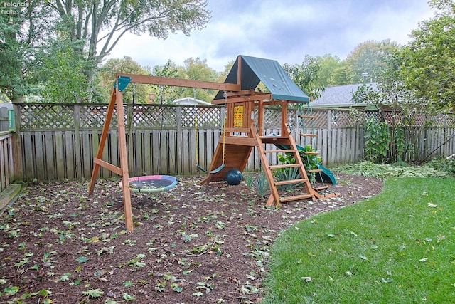 view of jungle gym with a lawn