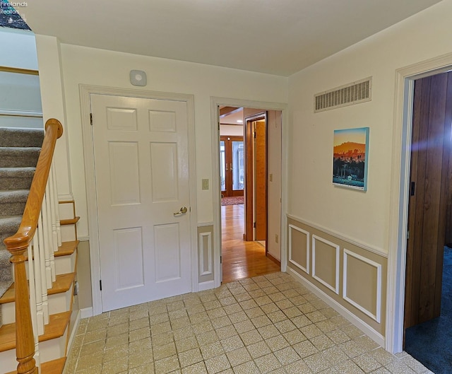 hall with light hardwood / wood-style floors