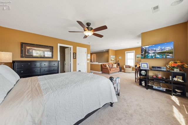 bedroom featuring ceiling fan and light colored carpet