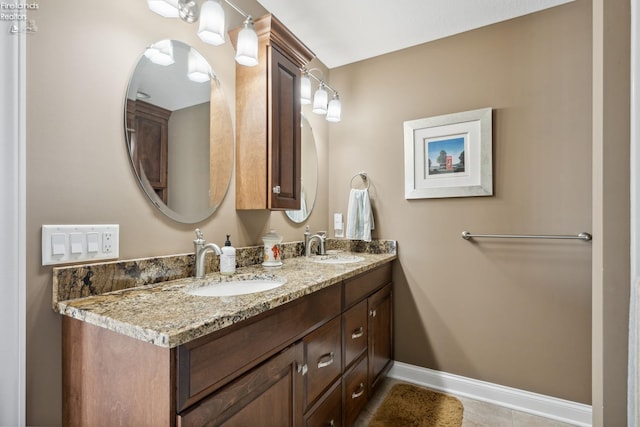 bathroom with tile patterned floors and vanity