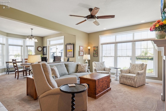 living room featuring light carpet and a wealth of natural light