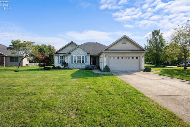 view of front of property with a front lawn and a garage