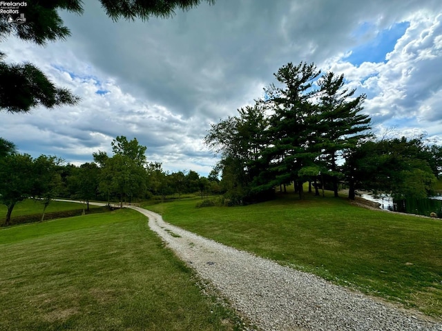view of property's community with a lawn