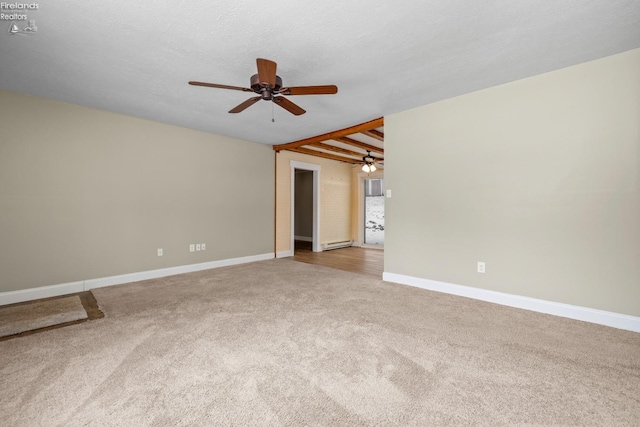 spare room with carpet floors, ceiling fan, baseboards, and baseboard heating