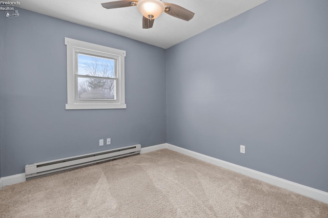 carpeted empty room with ceiling fan and baseboard heating