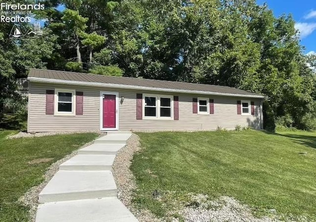 ranch-style house with a front lawn