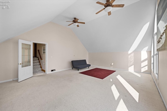 bonus room with light carpet, ceiling fan, and vaulted ceiling