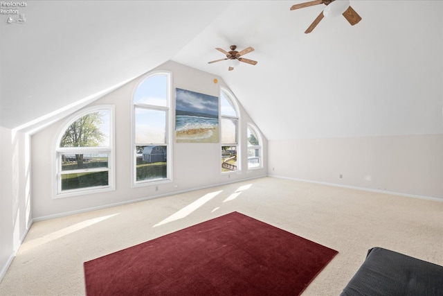 bonus room with vaulted ceiling, a wealth of natural light, and ceiling fan