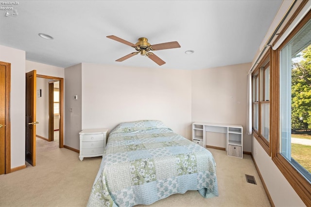 carpeted bedroom with ceiling fan