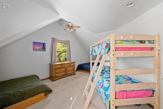 bedroom featuring lofted ceiling, carpet flooring, and ceiling fan