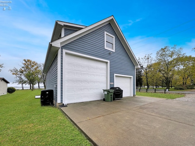 view of property exterior with a garage and a yard