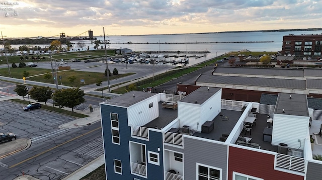 aerial view at dusk with a water view