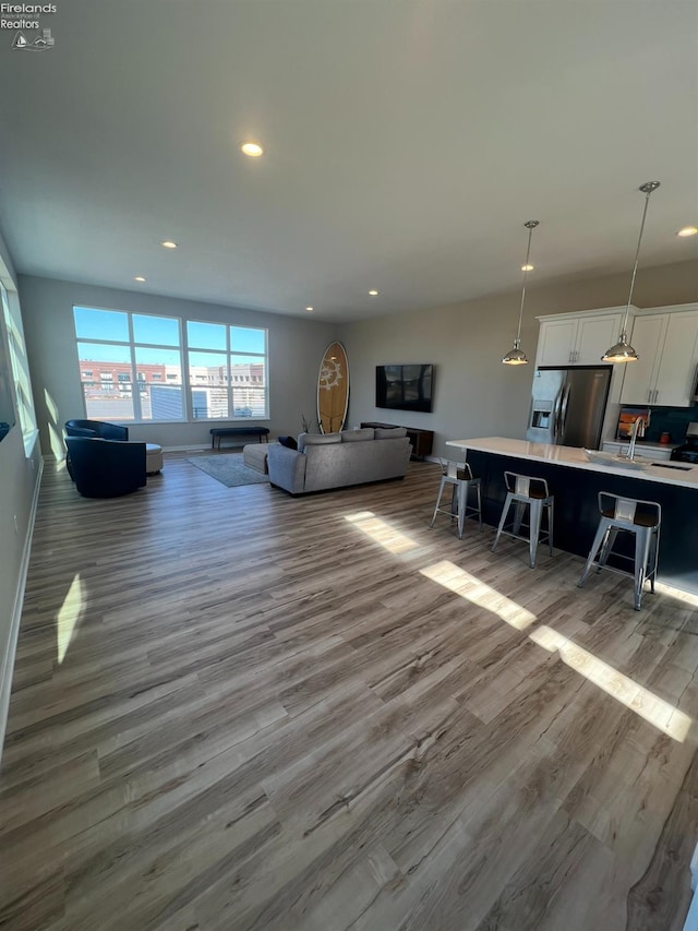 living room with light hardwood / wood-style flooring