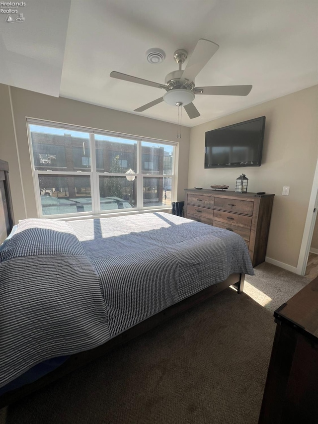 carpeted bedroom featuring ceiling fan