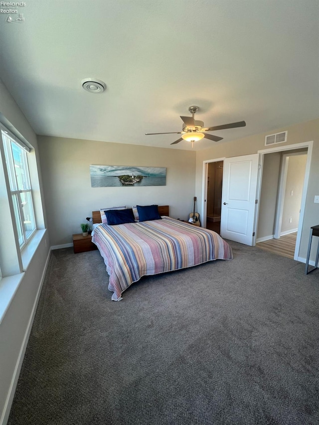 carpeted bedroom with ceiling fan