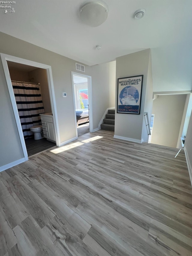 unfurnished living room featuring light hardwood / wood-style floors