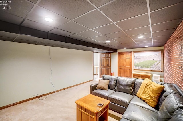 home theater featuring a paneled ceiling and carpet