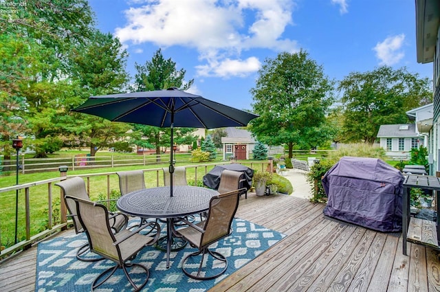 deck featuring a yard and area for grilling