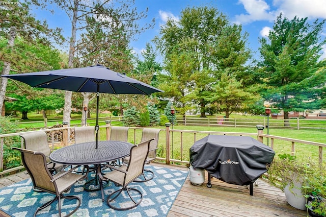 wooden terrace with area for grilling and a lawn