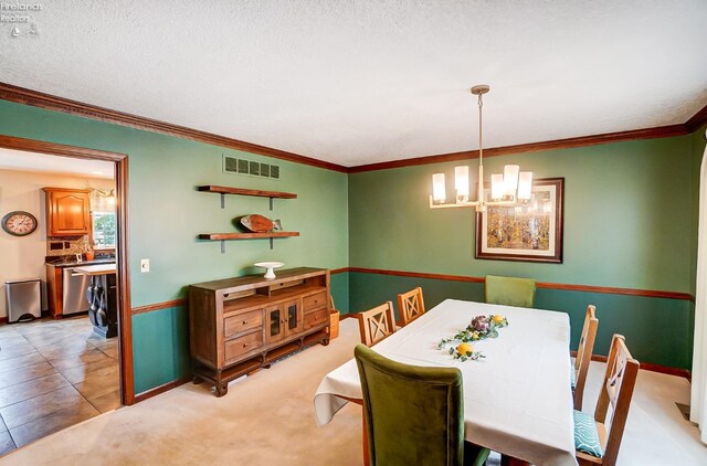 dining space featuring ornamental molding and a textured ceiling