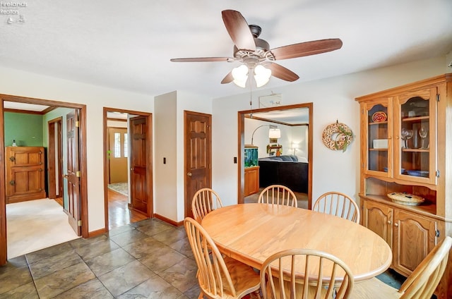 dining space with ceiling fan