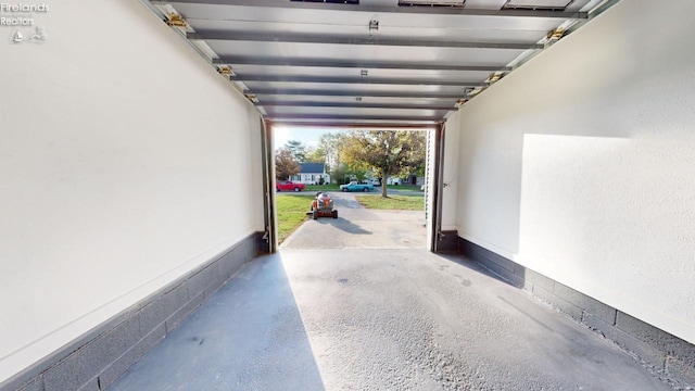 garage featuring a carport