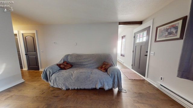 interior space with a baseboard radiator and dark hardwood / wood-style floors