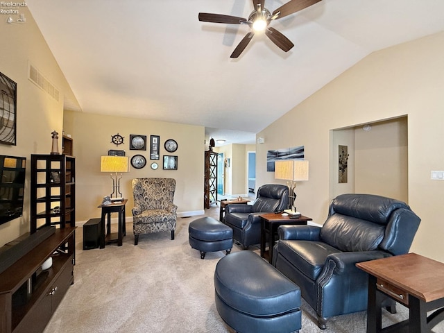 living room with ceiling fan, light colored carpet, and lofted ceiling