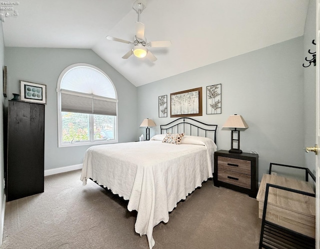 bedroom featuring dark colored carpet, vaulted ceiling, and ceiling fan