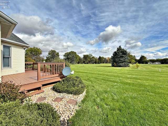 view of yard with a wooden deck