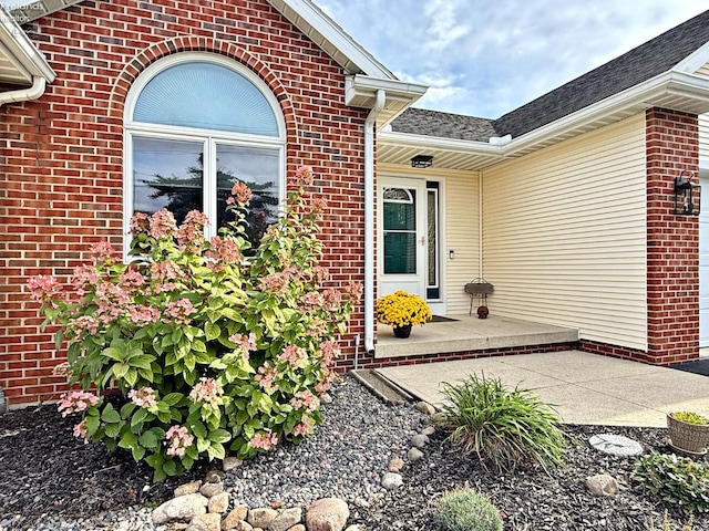 property entrance with a patio area