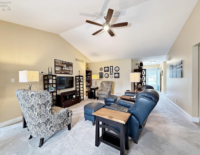 carpeted living room with ceiling fan and lofted ceiling