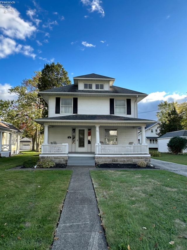 view of front of property featuring covered porch and a front yard