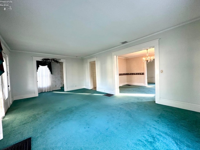 unfurnished living room featuring an inviting chandelier, ornamental molding, and carpet