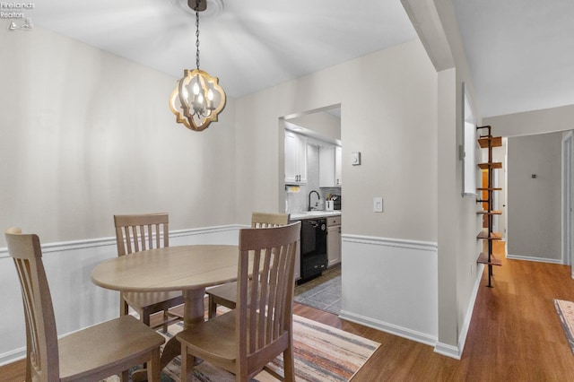 dining space featuring a notable chandelier and hardwood / wood-style floors