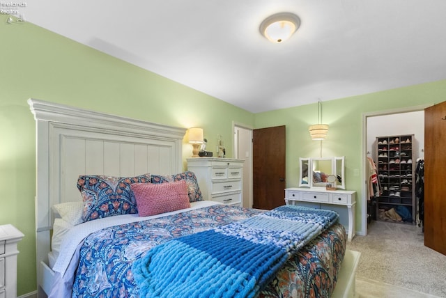 bedroom featuring light colored carpet