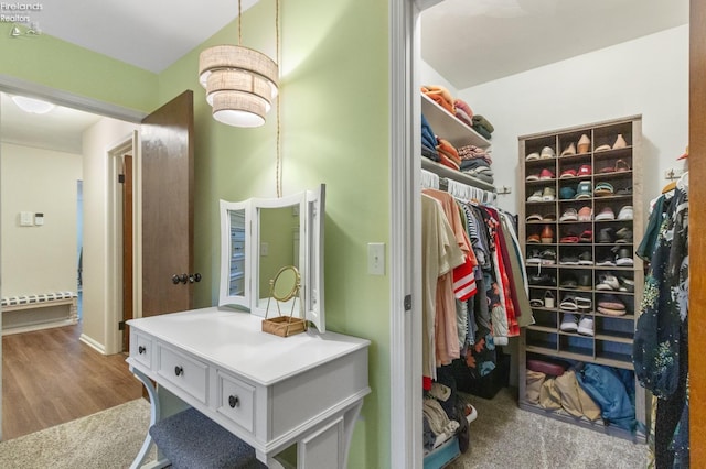 spacious closet featuring light hardwood / wood-style flooring