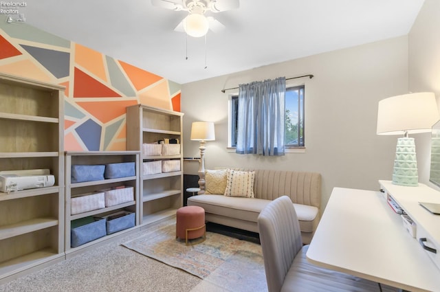 carpeted office featuring ceiling fan