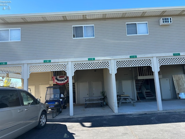 rear view of property with a carport