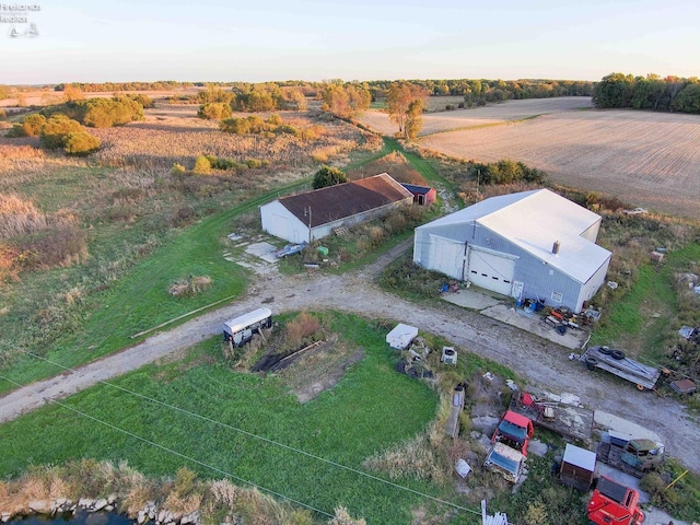 birds eye view of property featuring a rural view