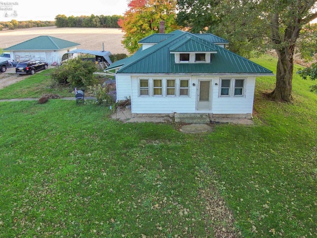 view of outbuilding with a yard