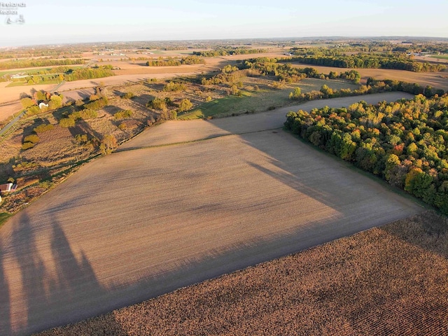 birds eye view of property with a rural view