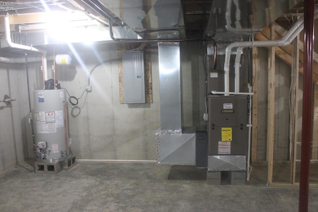 utility room featuring water heater and electric panel