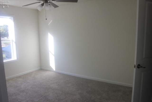 unfurnished room with carpet floors and ceiling fan