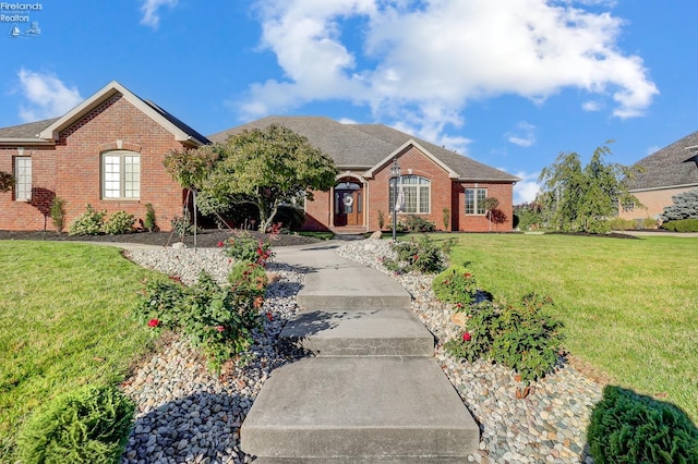 ranch-style house with a front lawn