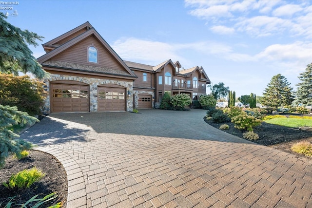 view of front of house featuring a garage and a balcony